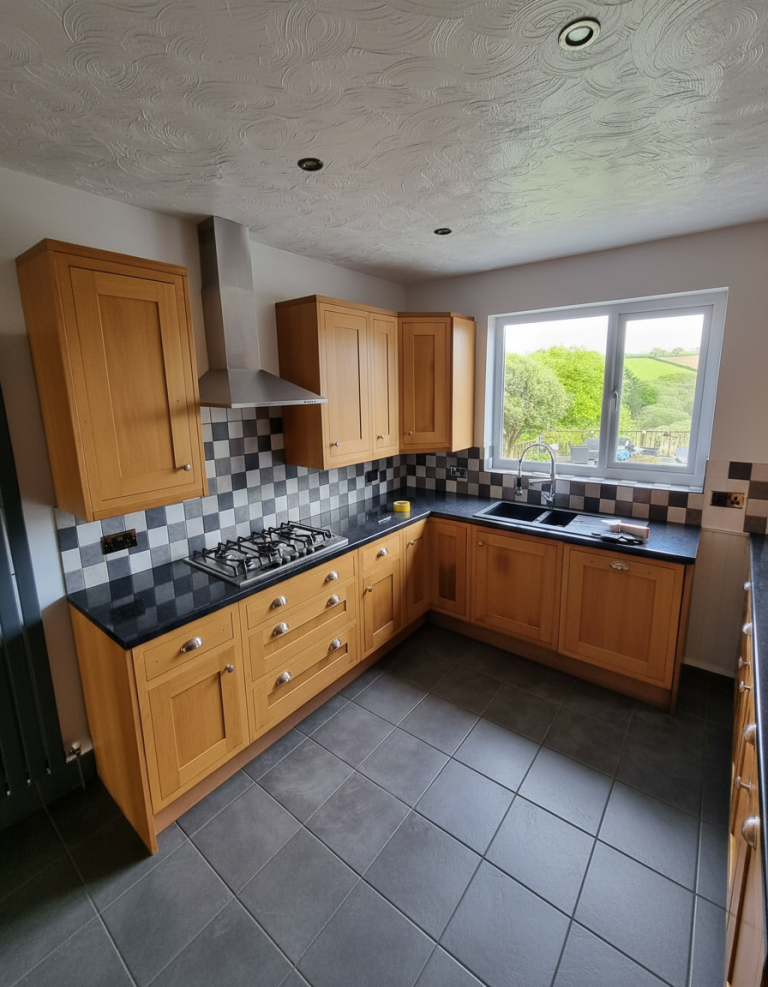 Dated oak kitchen cabinets before professional respraying and restoration in Limerick