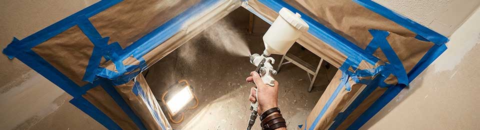 spray-painting-gun-and-masking-preparation-on-doors