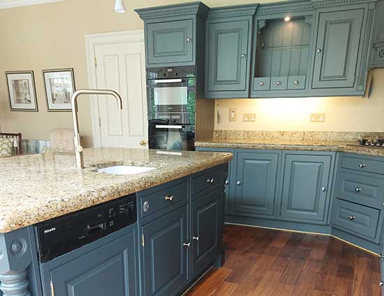 Kitchen respray Ireland showing modern blue sprayed cabinets with granite worktop and factory finish